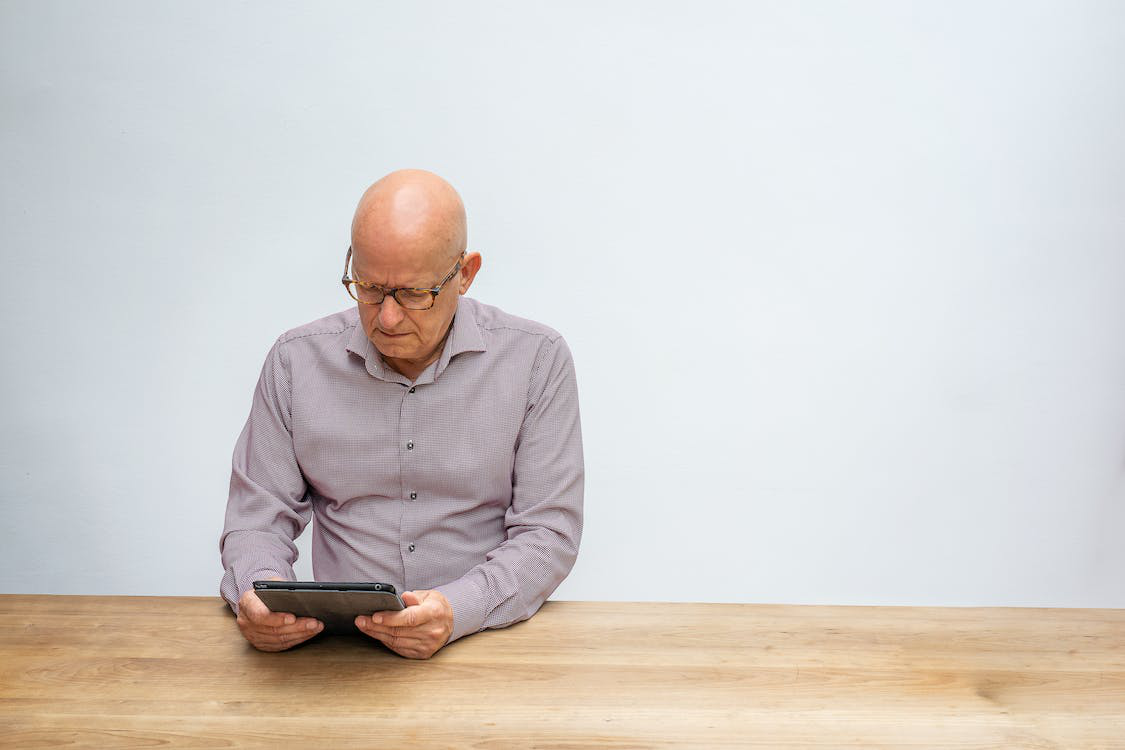 a person reading about the mediation on a tablet.